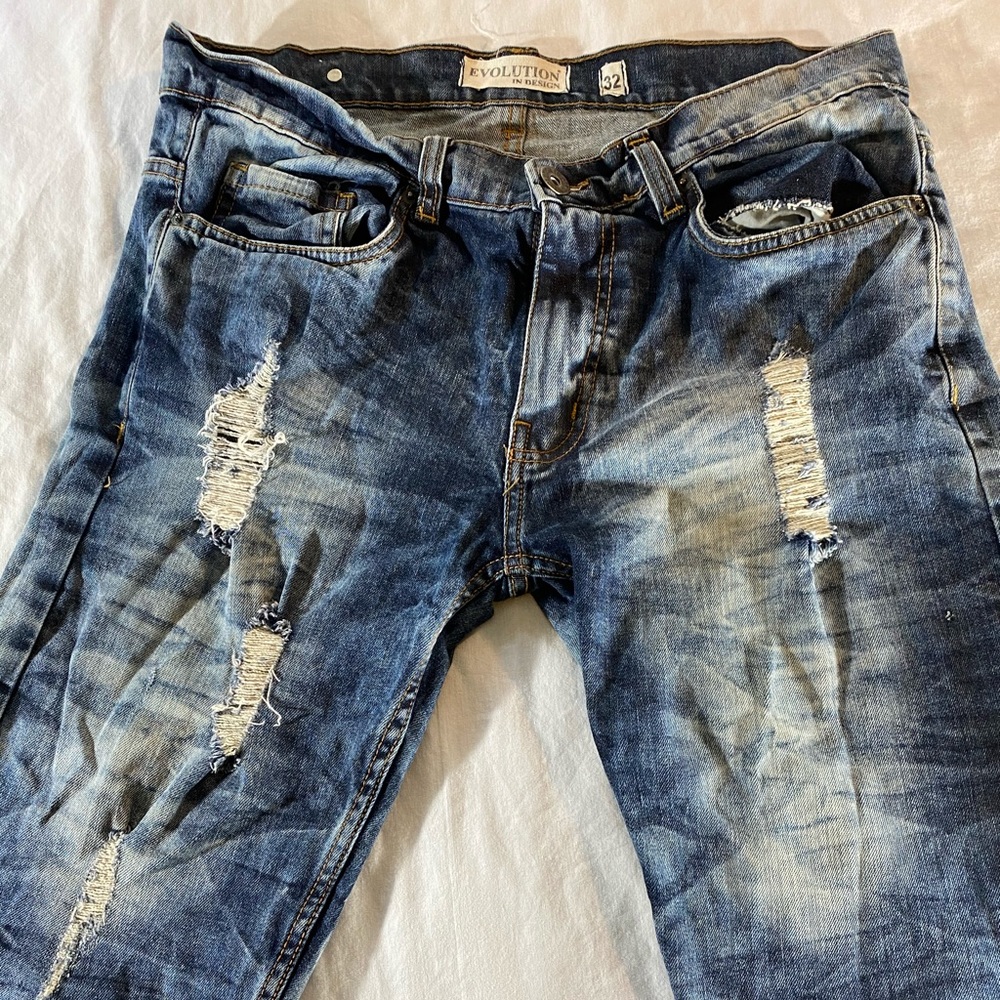 Ripped blue jean shorts